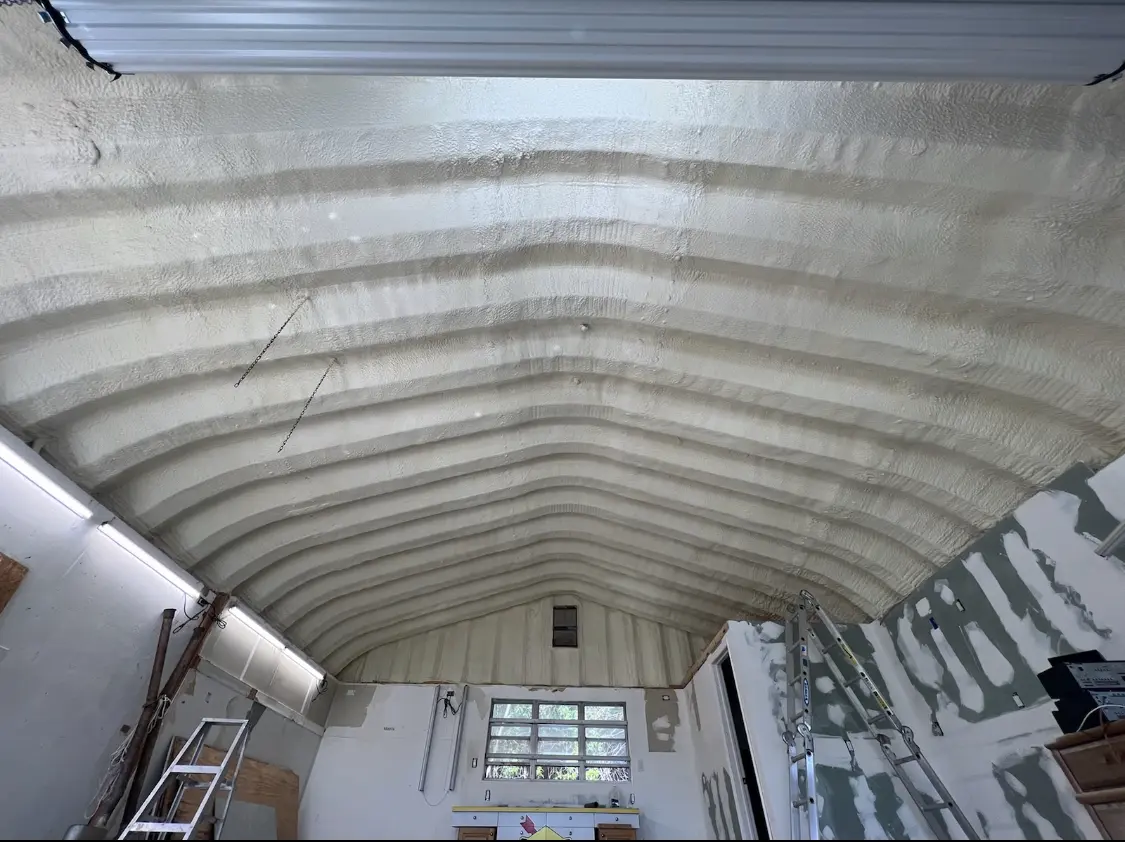 Spray polyurethane foam applied to the underside of a metal roof deck in Sebring